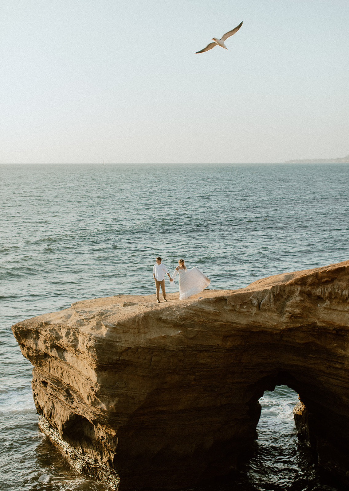 Sunset cliffs elopement, California. The stunning ocean and cliffs were the perfect backdrop for this styled elopement shoot with an adventurous style
